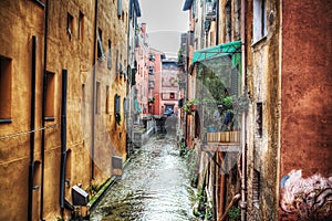 Narrow canal in Bologna downtown
