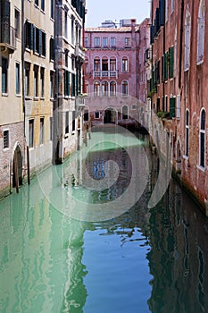 A narrow canal in Venice Italy Europe