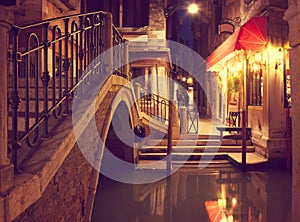 Narrow canal in Venice at night, Italy.