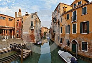 Narrow canal in Venice photo
