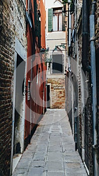 Narrow claustrofobic alley in Venice, Italy photo
