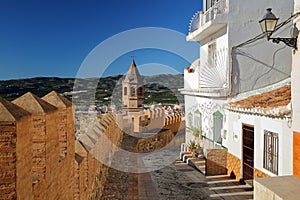 A narrow cobbled alley overlooking the town of Velez Malaga