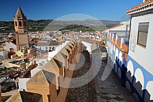 A narrow cobbled alley overlooking the town of Velez Malaga