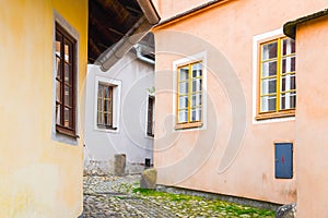 Narrow cobbled ancient street with picturesque colorful houses, Medieval old town of Tabor, Czech Republic