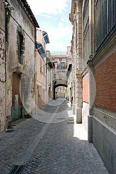 Narrow cobbled old street photo