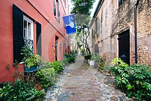 Narrow cobblestone street and old buildings in Charleston, South Carolina