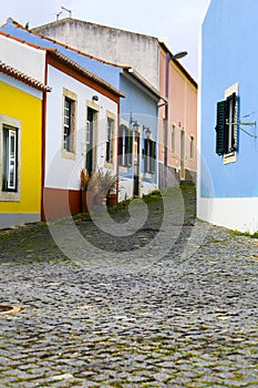 Narrow and colorful street, facades and balconies of Mafra