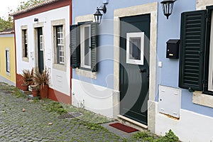 Narrow and colorful street, facades and balconies of Queluz