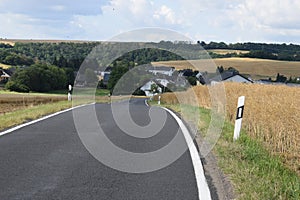 narrow country road down the hill into Welling, Eifel