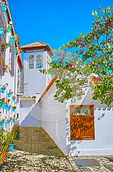 The white minaret of Mezquita Mayor Grand Mosque of Granada, Spain photo