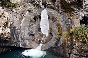 The narrow Falls Jaspe falls between the stone walls to the lake photo