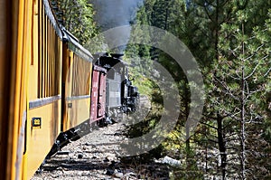 The Narrow Gauge Railway from Durango to Silverton that runs through the Rocky Mountains by the River Animas In Colorado USA