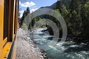 The Narrow Gauge Railway from Durango to Silverton that runs through the Rocky Mountains by the River Animas In Colorado USA