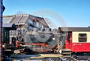Narrow-gauge railway and railway wagons at a train station in Wernigerode. Steam locomotive in the Harz. Saxony-Anhalt, Germany