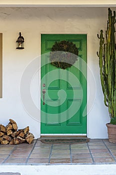 Narrow green front door, brown