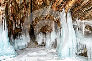 Narrow grotto and splash of ice on rock