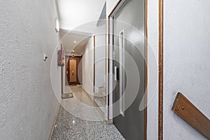 A narrow hallway on the landing of a residential building