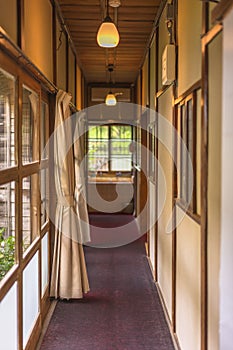 Narrow hallway of a traditional Japanese inn ryokan.