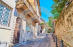 The narrow hilly Contrada Sant`Urbano street, Brescia, Italy