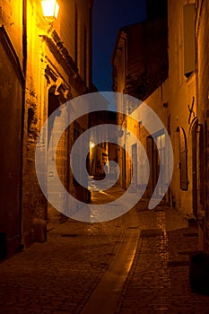 Narrow lanes in Uzes France by night photo