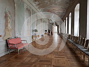 Narrow and long hall with a painted ceiling and walls at Rundale Castle on the territory of Latvia on May 10, 2019