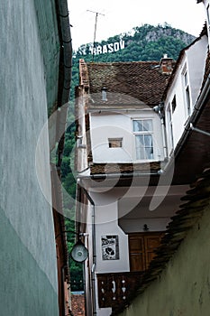 Narrow medieval street in the European city of Brasov, Romania. Eastern Europe architecture