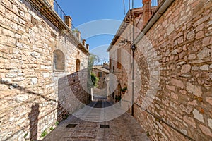 Narrow medieval street in Spello. Umbria, Italy