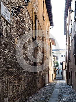 narrow medieval street Via dei Musei in Brescia photo