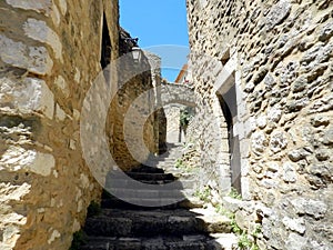 Medieval street with stairs and arches, Saint-Montan, South of France photo