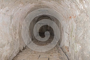 Narrow medieval tunnel made of bricks