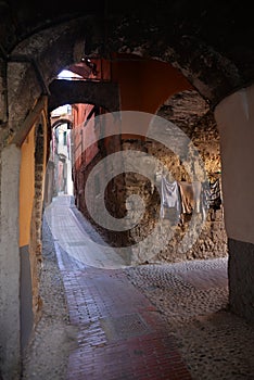 Narrow old street, city of Ventimiglia, Italy