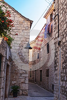 Narrow old street in Jelsa town, Hvar, Croatia