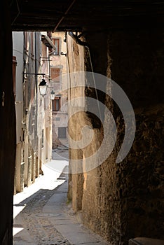 Narrow old street, village of Tende, France