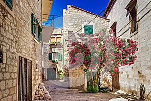 Narrow old streets and yards in Sibenik city, medieval photo