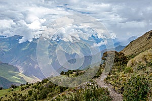 Narrow path on the hiking trail at high altitude Peruvian mountains between Maizal and Yanama, Peru photo