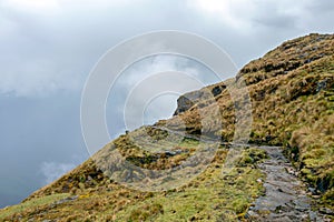 Narrow path on the hiking trail at high altitude Peruvian mountains between Maizal and Yanama, Peru photo