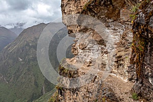 Narrow path on the hiking trail at high altitude Peruvian mountains between Maizal and Yanama, Peru photo