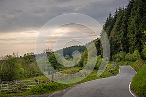 Narrow paved road through the rural countryside in central Wales