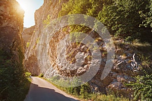 Narrow road pass between rocky cliffs