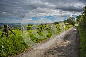 Narrow road through the rural Welsh farmland