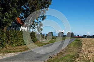 Narrow road from the village of Dannemare Lolland Denmark
