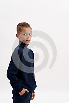 Narrow shot of small boy child on white background