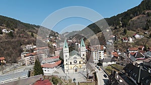 Narrow small streets and classic buildings of small city Vares in Bosnia and Herzegovina. Aerial view, FPV drone flight