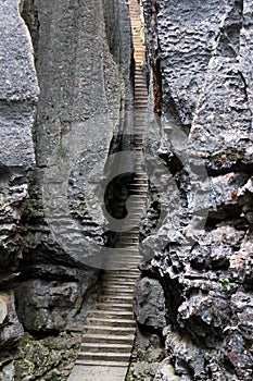 Narrow stairway in SShilin stone forest, world-famous natural karst area, China