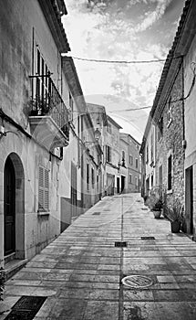 Narrow steep street in Alcudia old town, Mallorca