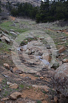 Narrow stream of Charon's Garden trail in Wichita Mountains Wildlife in Oklahoma photo