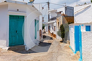 Narrow street of ancient Archangelos scenic old town with castle on Rhodes island, Dodecanese, Greece. Beautiful picturesque white