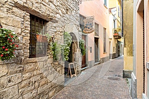 Narrow street of ancient village Torno, overlooking Lake Como, Italy photo