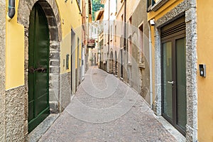 Narrow street of ancient village Torno, overlooking Lake Como, Italy photo