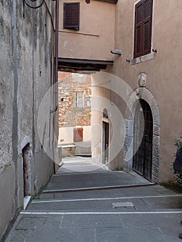 Narrow Street with Ancient Walls and Houses in the Village of  Colonnata, Carrara- Italy